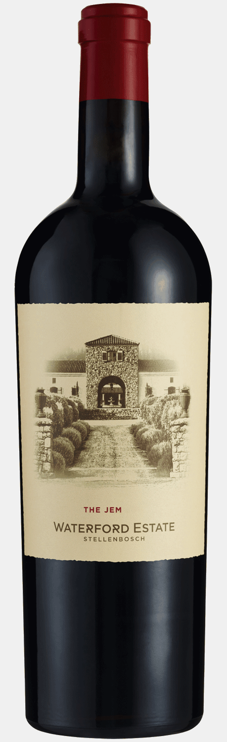 Eine Flasche Waterford Estate Rotwein mit rotem Verschluss steht neben einem schwarzen Geschenkkarton mit goldenem Etikett und goldener horizontaler Schleife. Das Weinetikett zeigt die Illustration eines Steingebäudes und die Aufschrift "The Jem, Waterfo